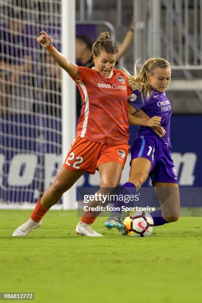 Houston Dash defender Amber Brooks and Orlando Pride forward Rachel Hill go for the ball during the soccer match between the Orlando Pride and the...