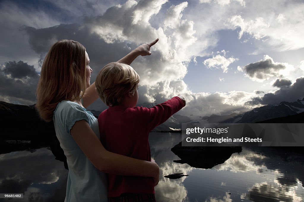 Boy and girl watching the sky