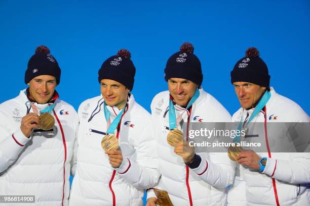 Members of the French bronze medallist team, Jean Marc Gaillard , Maurice Manificat, Clement Parisse and Adrien Backscheider celebrate during the...