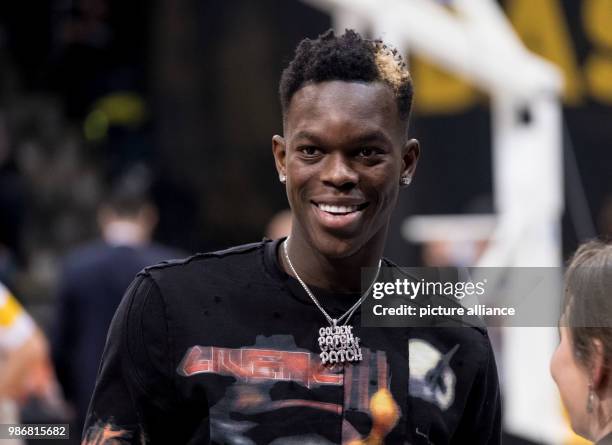 February 2018, Germany, Braunschweig: NBA star Dennis Schroeder visits a basketball match between Lions Brauschweig and Mitteldeutscher BC at the...