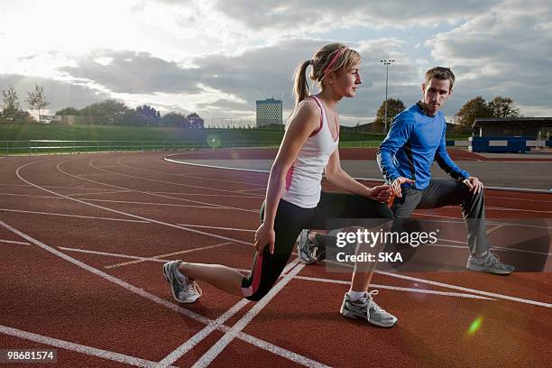 2 athletes training together - train tracks stockfoto's en -beelden