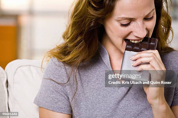 woman at home - eating chocolate stock pictures, royalty-free photos & images
