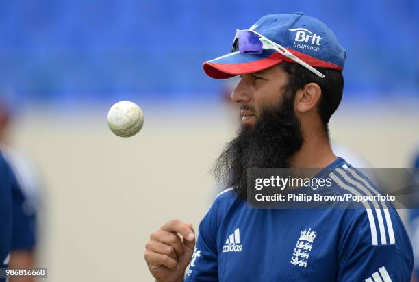 Moeen Ali of England tosses a ball during a training session before the 1st One Day International between West Indies and England at Sir Vivian...