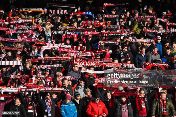 February 2018, Germany, Nuremberg: German 2nd division Bundesliga soccer match 1. FC Nuremberg vs MSV Duisburg: Nuremberg's fans celebrate the 3-1...