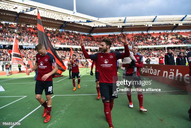 February 2018, Germany, Nuremberg: German 2nd division Bundesliga soccer match 1. FC Nuremberg vs MSV Duisburg: Nuremberg's team celebrates their 3-1...