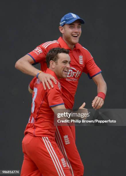 England's Stephen Parry and captain Stuart Broad celebrate after they combined to dismiss Darren Sammy of West Indies during the 2nd One Day...