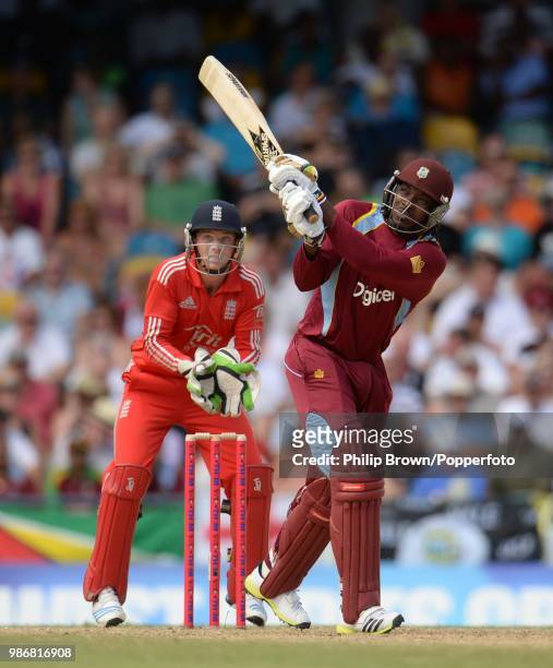 West Indies batsman Chris Gayle hits a six during the 1st Twenty20 International between West Indies and England at the Kensington Oval, Bridgetown,...