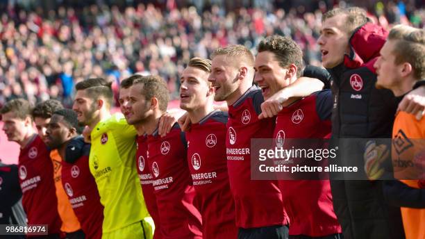 February 2018, Germany, Nuremberg: German 2nd division Bundesliga soccer match 1. FC Nuremberg vs MSV Duisburg: Nuremberg's team celebrates their 3-1...