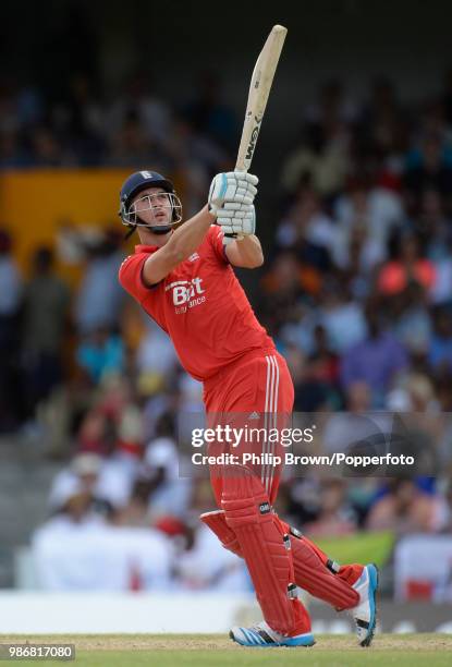 England opener Alex Hales hits a boundary during the 3rd Twenty20 International between West Indies and England at the Kensington Oval, Bridgetown,...