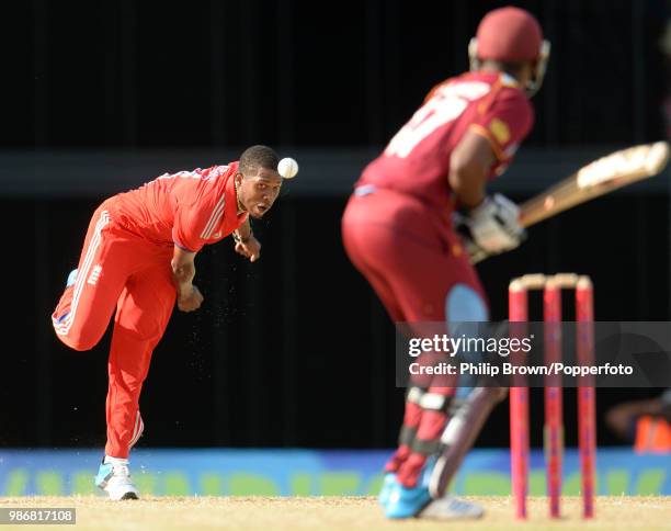 Chris Jordan of England bowls to West Indies batsman Dwayne Bravo during the 3rd Twenty20 International between West Indies and England at the...