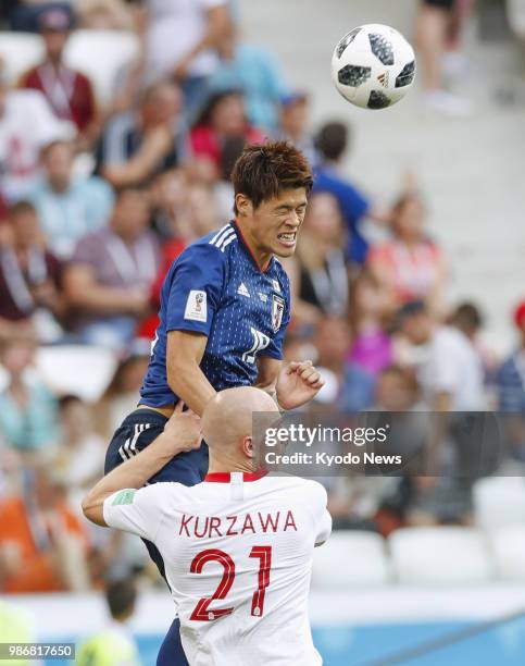 Japan's Hiroki Sakai towers above Poland's Rafal Kurzawa during the second half of a World Cup group stage match at Volgograd Arena in Volgograd,...