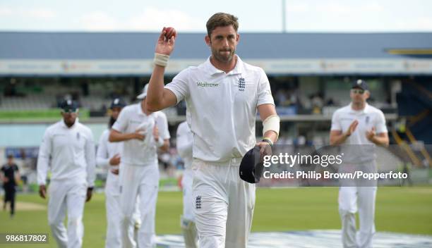 Liam Plunkett of England salutes the crowd as he is applauded from the field after taking five wickets in Sri Lanka's first innings of the 2nd Test...