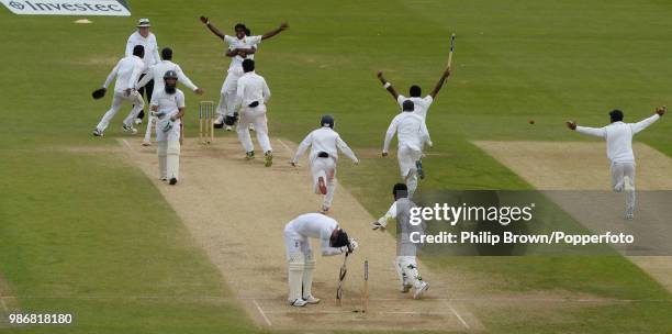 England's James Anderson despairs after losing England's last wicket and Sri Lanka's Shaminda Eranga is congratulated for taking the wicket as Sri...