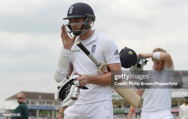 James Anderson and Joe Root of England leave the field for the lunch break during their record-breaking 10th-wicket partnership of 198 runs in the...