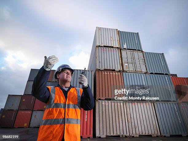 port worker with shipping containers - immingham stock pictures, royalty-free photos & images