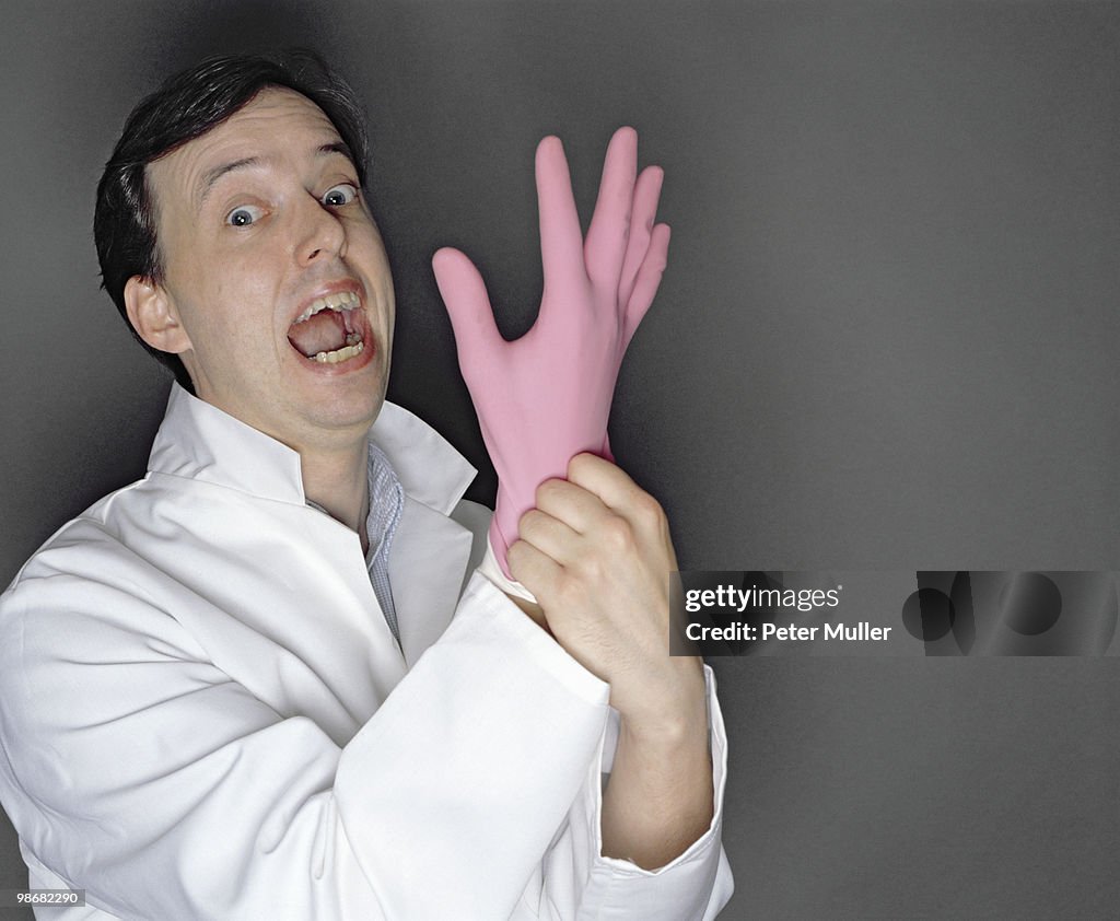 Man putting rubber glove on