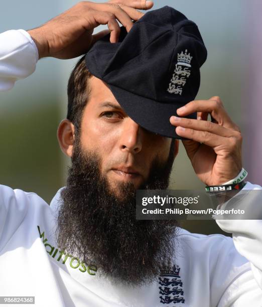 Moeen Ali of England adjusts his cap wearing 'Save Gaza' and 'Free Palestine' wristbands during the 3rd Test match between England and India at the...
