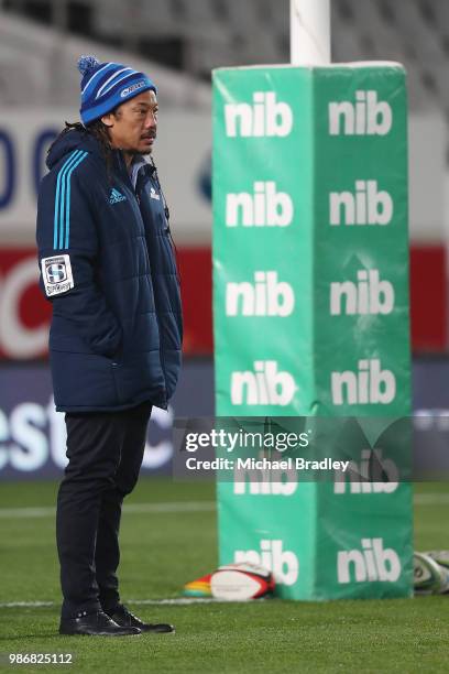 Blues coach Tana Umaga watches the team warm up prior to the round 17 Super Rugby match between the Blues and the Reds at Eden Park on June 29, 2018...