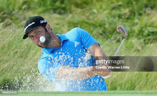 Jon Rahm of Spain plays from a green side bunker during the second round of the HNA Open de France at Le Golf National on June 29, 2018 in Paris,...