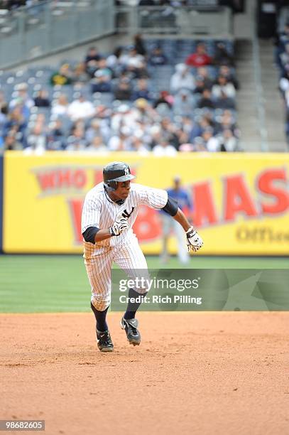 Curtis Granderson of the New York Yankees runs to third during the game against the Texas Rangers at Yankee Stadium in the Bronx, New York on April...