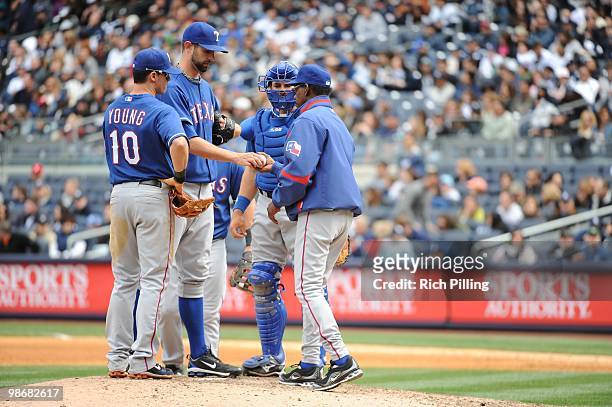 Ron Washington, manager of the Texas Rangers visits the mound to make a pitching change during the game against the New York Yankees at Yankee...
