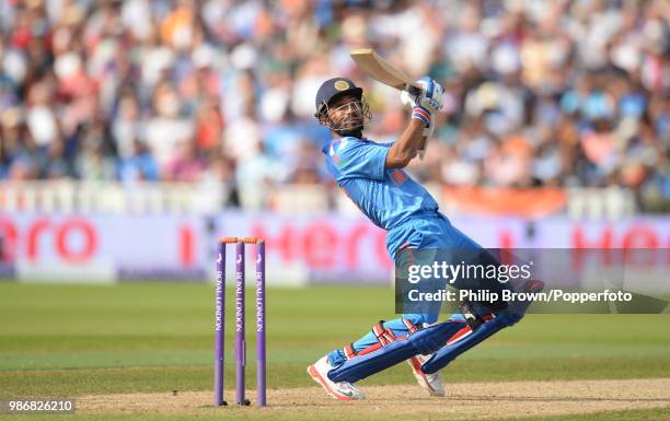 Ajinkya Rahane of India ramps the ball to the boundary during his innings of 106 in the 4th Royal London One Day International between England and...