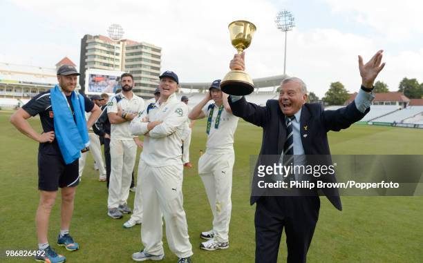 Yorkshire president Dickie Bird celebrates with the County Championship trophy after Yorkshire won the LV County Championship with victory over...