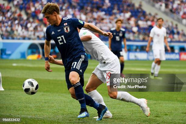 Gotoku Sakai of Japan Piotr Zielinski of Poland during the 2018 FIFA World Cup Group H match between Japan and Poland at Volgograd Arena in...