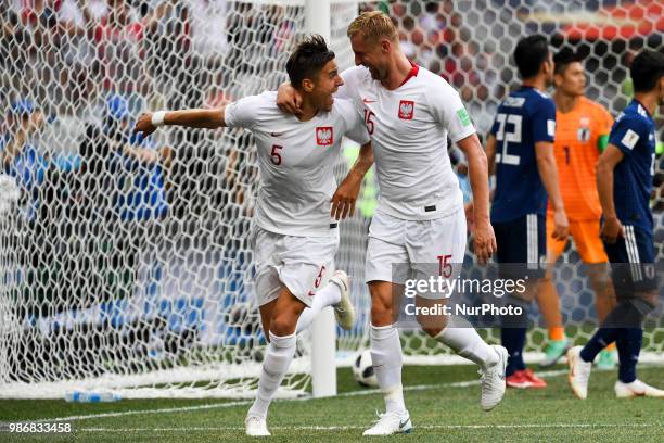 Jan Bednarek and Kamil Glik of Poland celebrate scoring during the 2018 FIFA World Cup Group H match between Japan and Poland at Volgograd Arena in...