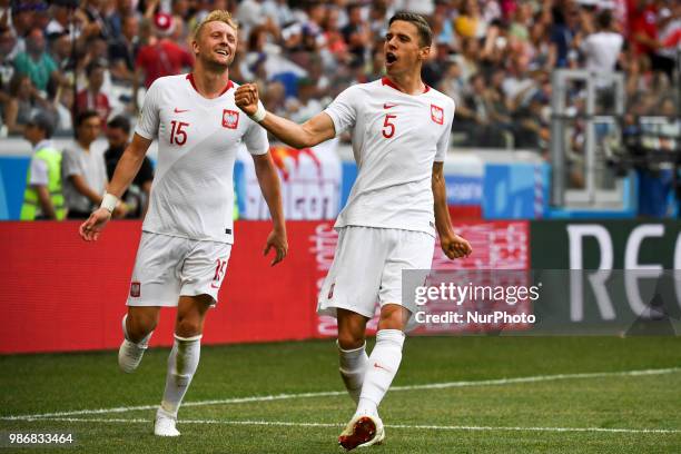 Jan Bednarek of Poland celebrate his goal with Kamil Glik during the 2018 FIFA World Cup Group H match between Japan and Poland at Volgograd Arena in...