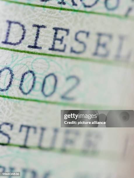 February 2018, Cologne, Germany: The word "DIESEL" is printed on a vehicle registration document. The air within German urban areas has worsened. The...