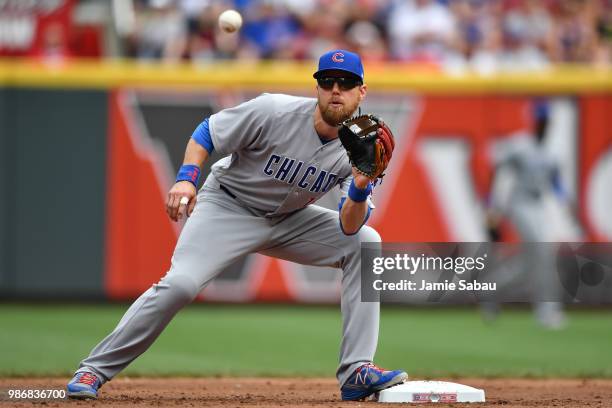 Ben Zobrist of the Chicago Cubs takes a throw at second base against the Cincinnati Reds at Great American Ball Park on June 23, 2018 in Cincinnati,...