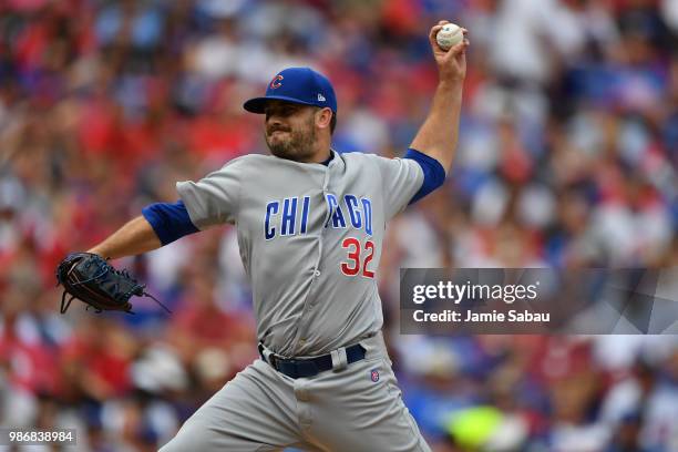 Brian Duensing of the Chicago Cubs pitches against the Cincinnati Reds at Great American Ball Park on June 23, 2018 in Cincinnati, Ohio.