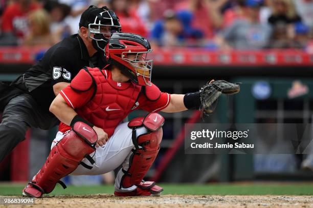 Tucker Barnhart of the Cincinnati Reds catches against the Chicago Cubs at Great American Ball Park on June 23, 2018 in Cincinnati, Ohio.