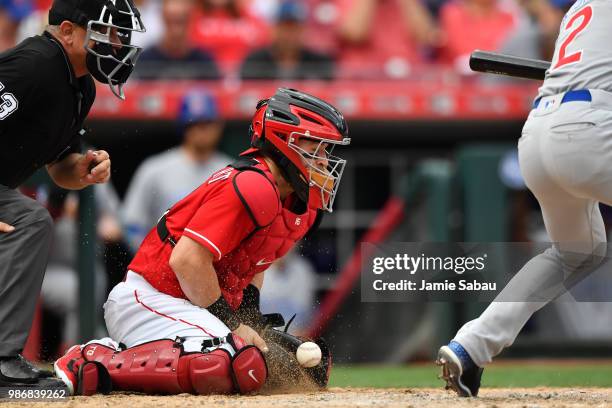 Tucker Barnhart of the Cincinnati Reds catches against the Chicago Cubs at Great American Ball Park on June 23, 2018 in Cincinnati, Ohio.