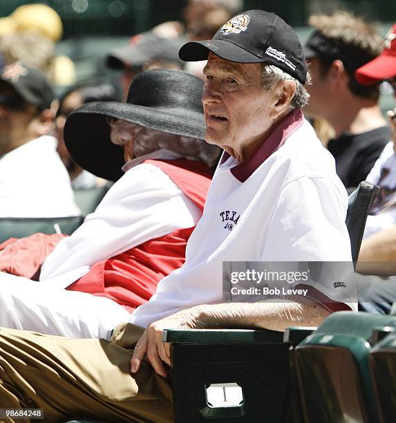 Former President George H.W. Bush and Barbara Bush attend a baseball game between the Pittsburgh Pirates and the Houston Astros at Minute Maid Park...