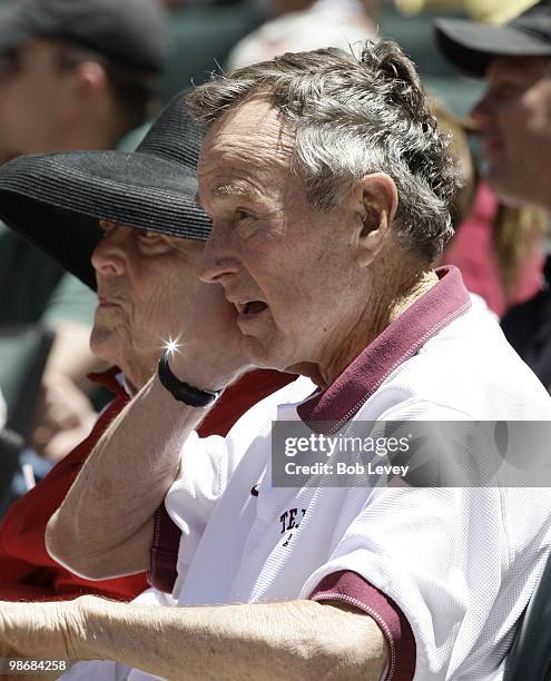 Former President George H.W. Bush and Barbara Bush attend a baseball game between the Pittsburgh Pirates and the Houston Astros at Minute Maid Park...