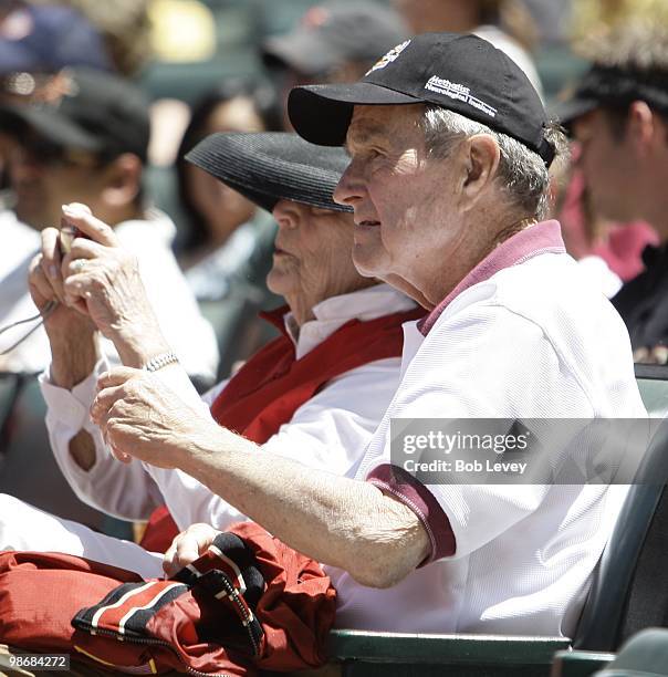 Former President George H.W. Bush and Barbara Bush attend a baseball game between the Pittsburgh Pirates and the Houston Astros at Minute Maid Park...