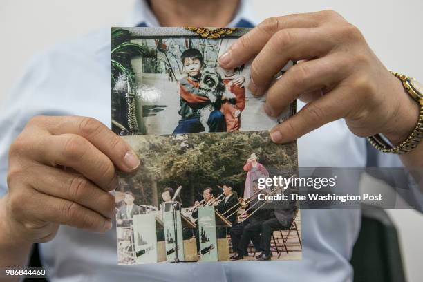 Heo Yeong-hui holds the photo of her son, above, Choi Gyeong-hak, at left, and his dog, taken when he was 11 or 12 years old in North Korea, and her...