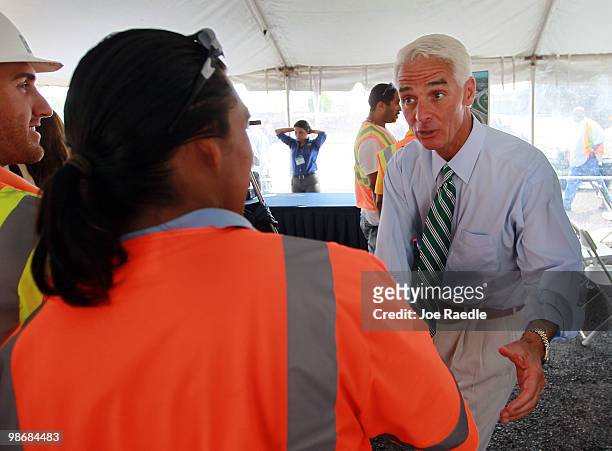 Florida Governor Charlie Crist greets workers as he attends the 826/836 Interchange Project Dedication Ceremony on April 26, 2010 in Miami, Florida....