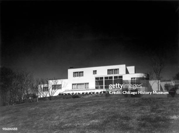 Exterior view of the James J. Schramm residence, located on a bluff over looking the river in Burlington, IA, 1940. Located at 2685 South Main Street.