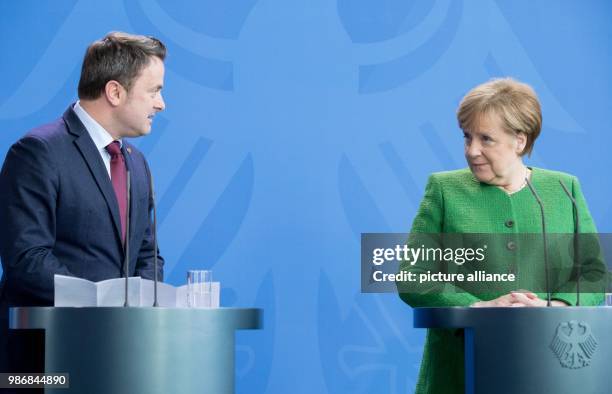 Dpatop - Luxembourger Prime Minister Xavier Bettel speaks during a press conference with German Chancellor Angela Merkel at the German Chancellery in...