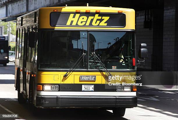 Hertz shuttle bus drives through O'Hare International Airport in Chicago, Illinois, U.S., on Monday, April 26, 2010. Hertz Global Holdings Inc., the...