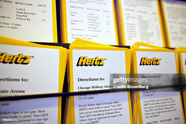 Hertz logo appears on driving directions on display at O'Hare International Airport in Chicago, Illinois, U.S., on Monday, April 26, 2010. Hertz...