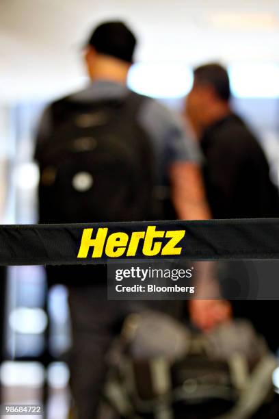 Hertz logo is displayed near the rental counter at O'Hare International Airport in Chicago, Illinois, U.S., on Monday, April 26, 2010. Hertz Global...