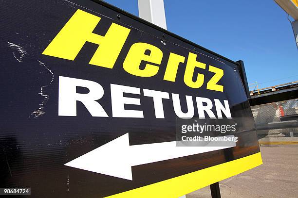 Sign directs customers where to return vehicles outside the Hertz location at O'Hare International Airport in Chicago, Illinois, U.S., on Monday,...