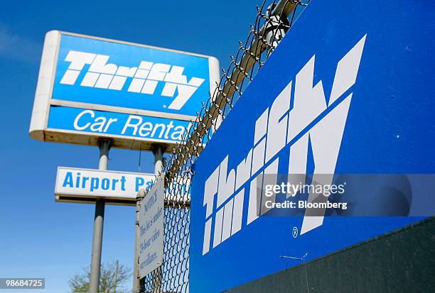 Thrifty sign stands at O'Hare International Airport in Chicago, Illinois, U.S., on Monday, April 26, 2010. Hertz Global Holdings Inc., the world's...