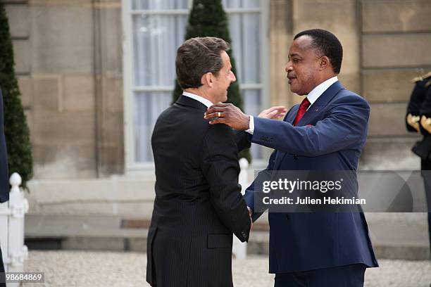 French President Nicolas Sarkozy welcomes Congolese President Denis Sassou N'Guesso at the Elysee Palace in Paris on April 26, 2010. Among other...