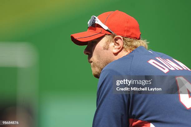 Adam Dunn of the Washington Nationals looks on during practice of a baseball game against the Colorado Rockies on April 22, 2010 at Nationals Park in...