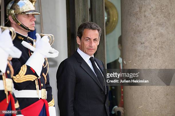 French President Nicolas Sarkozy waits for for the arrival of Congolese President Denis Sassou N'Guesso at the Elysee Palace in Paris on April 26,...